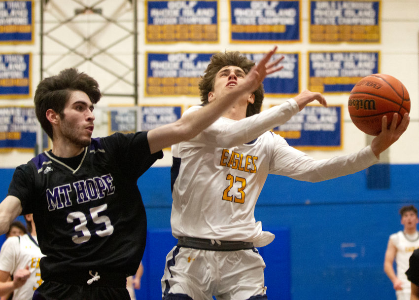 Matt Raffa drives to the basket guarded by James Rustici of Mt. Hope during the Eagles&rsquo; win on Friday. Raffa scored 23 points in the victory.