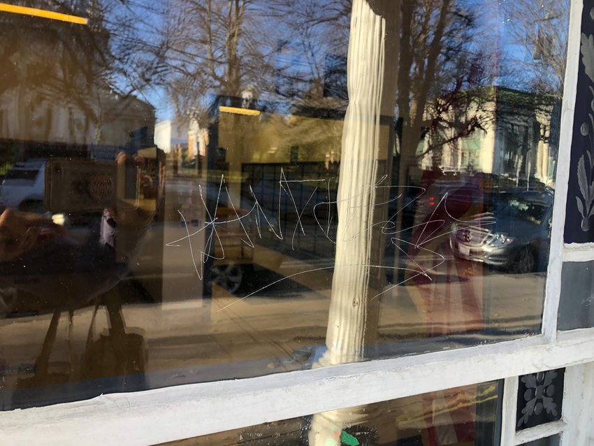 This example of vandalism was scratched into the window of the Bristol Post Office on Hope Street.