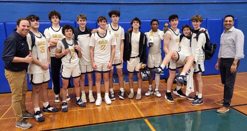 Members of the BHS boys basketball team gather for a quick photo following their win over Smithfield on Monday night, Dec. 19.