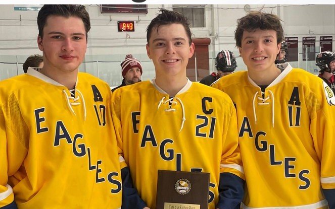 Barrington High School senior captains Tucker Squires, Christian Vieira and Cole Vieira (from left to right) display the Cape Ann Savings Bank Holiday Tournament plaque.