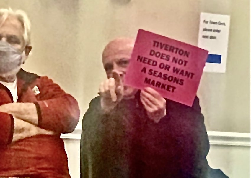 A protestor at Wednesday evening's Tiverton Zoning Board meeting.