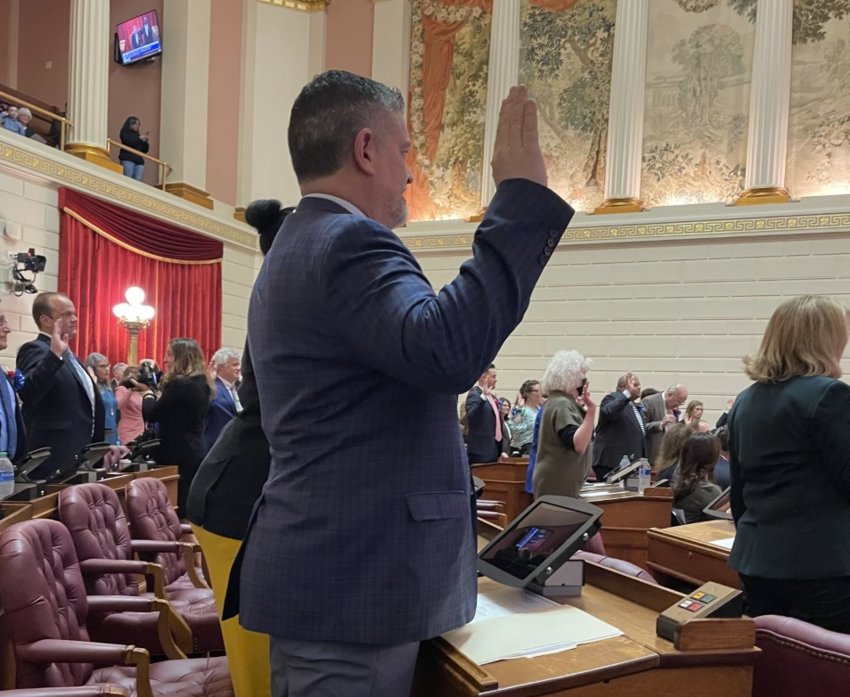 Matt Dawson takes the oath of office as the representative from East Providence District 65 Tuesday, Jan. 3, during the opening session of the Rhode Island General Assembly in the lower chamber of the State House.