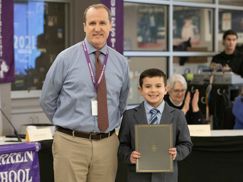 Hugh Cole principal Colin Grimsley poses with 4th&nbsp;grade&nbsp;student Ian Teixeira after he was recognized for achieving a perfect score on his 4th grade RICAS math assessment.