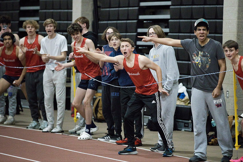 Members of the Portsmouth High indoor track team cheer for Wake Zani as he runs the final leg of the 4x400 relay race during Friday&rsquo;s meet. The team of Zani, Maciej Tabak, Nikolai Loyola, and Oliver Tibbetts came in first place with a time of 3:46.79.