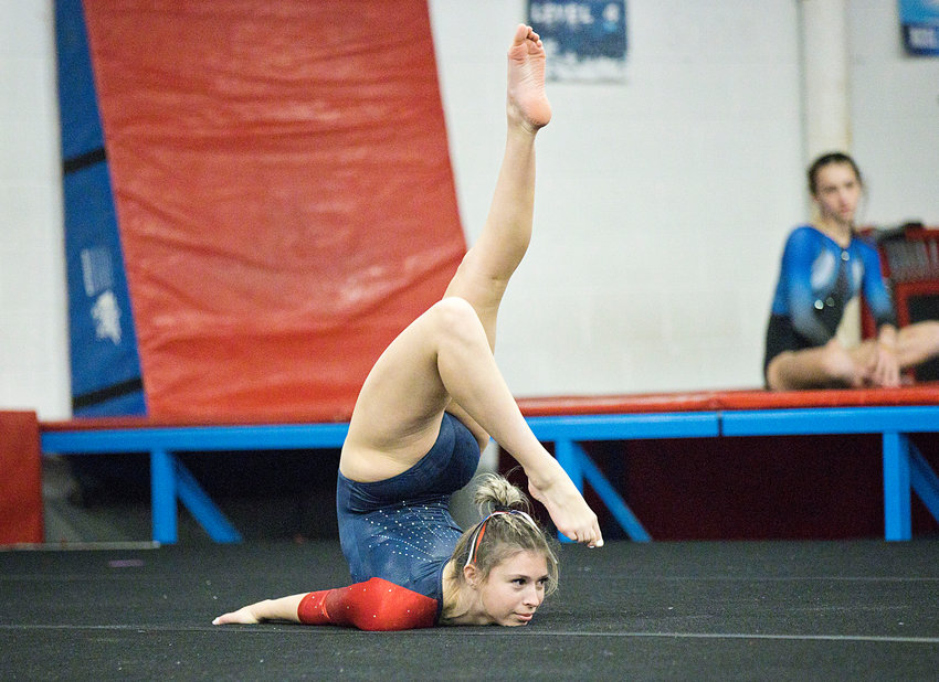 Portsmouth High&rsquo;s Sierra Bonoff contorts herself while delivering her floor routine at Saturday&rsquo;s gymnastics meet against Middletown, Mt. Hope, and Rogers/East Providence. She earned a 7.9 for the event.