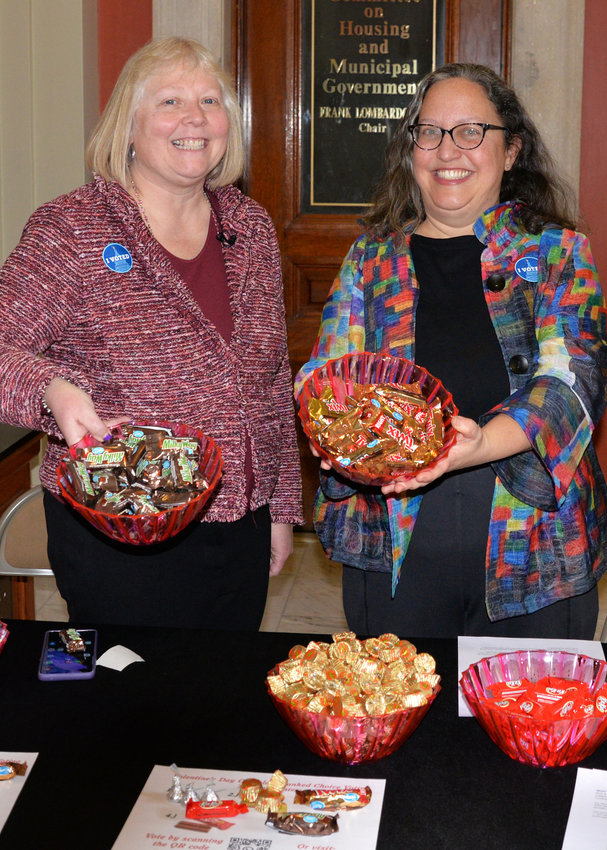 Sen. Valarie Lawson (left), a Democrat who represents District 14 in East Providence, and Rep. Rebecca Kislak, a fellow Dem from District 4 on the capital city&rsquo;s East Side, used a &ldquo;chocolate election&rdquo; on Valentine&rsquo;s Day Tuesday, Feb. 14, as the premise for a demonstration on ranked-choice voting, about which each submitted formative legislation to their respective chambers earlier in the week.