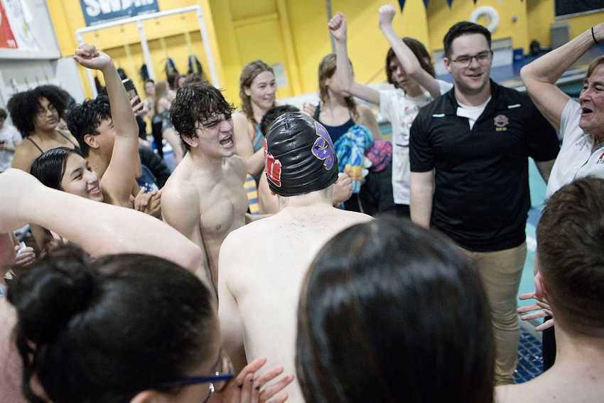 Coaches Mike Constantino and Kate Farrington (middle) of the PCD/St. Ray's Swim Co-op celebrates after winning the 2023 Division IV championship by both its boys&rsquo;s and girls&rsquo; swim teams.