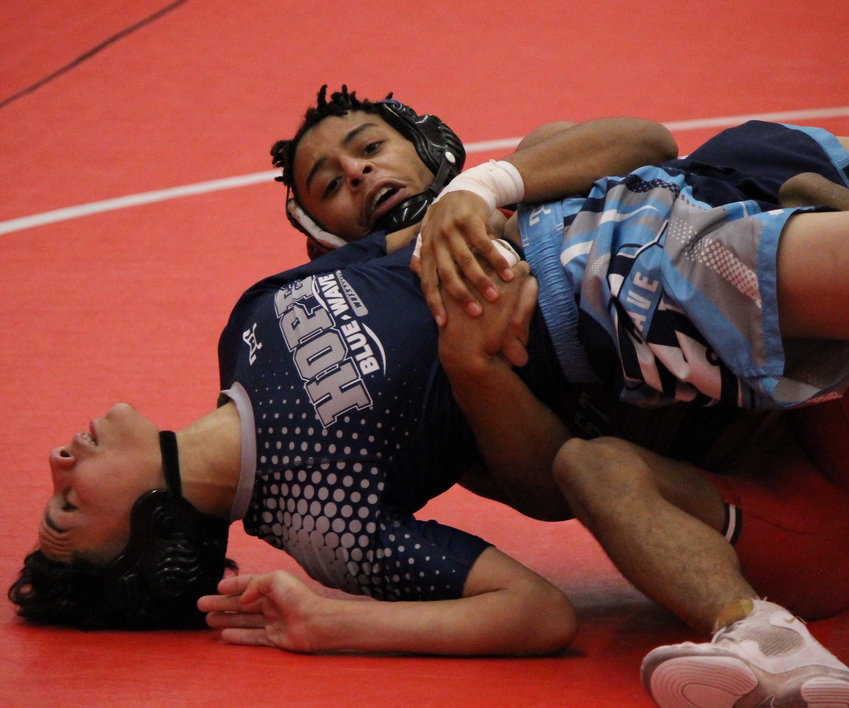 East Providence High School's Martin Moniz pins his opponent during a recent Division I regular season match against Hope. Moniz is considered to be one of the favorites in the 120-pound weight class at the 2023 state championship meet February 24 and 25.