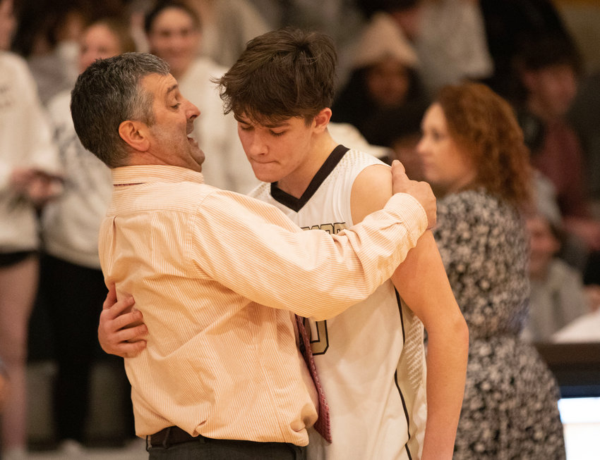 Head coach Scot Boudria consoles senior Cam Leary after the Wildcats lost to Mount Greylock 55-52 in the Division 5 Sweet 16 at Westport on Monday night.