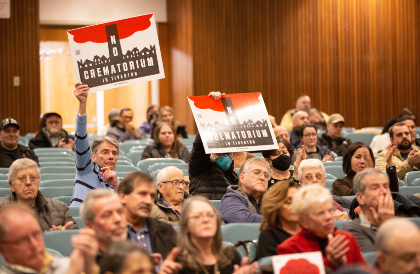 Residents come out to protest a crematorium proposed for a vacant lot at 730 Main Road during the Tiverton Planning Board meeting at the high school on Tuesday.