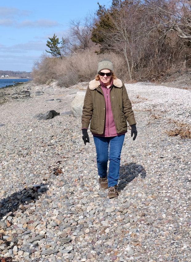 Rep. Terri Cortvriend walks along the shoreline in front of Baker Road homes on the town&rsquo;s west side over the weekend. Her bill in the House of Representatives, which seeks to clarify just where shoreline visitors are allowed to roam once entering via a legal right of way, has caused controversy with some waterfront property owners.