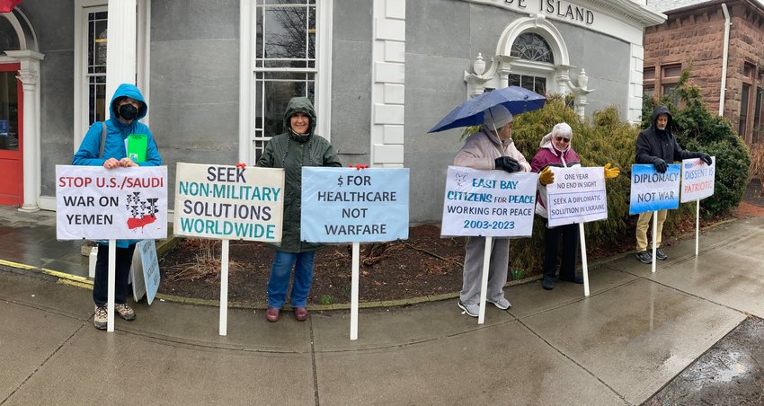 Members of East Bay Citizens for Peace recently held a vigil outside the Bristol Post Office.