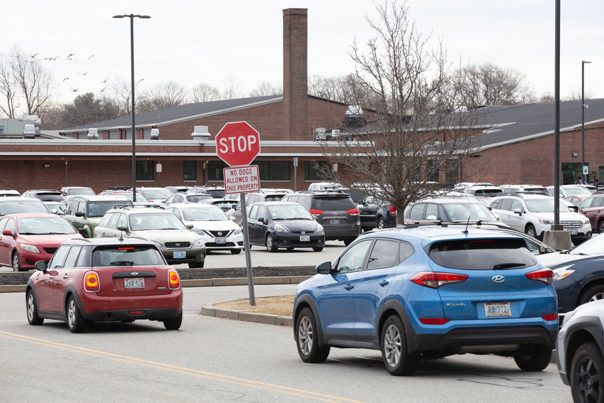 Cars roll into the Barrington High School student parking lot on a recent weekday morning.