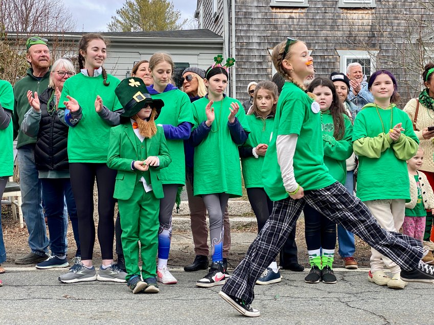Dancers from the Clann Lir Academy of Irish Dance wow the crowd as they stop to perform along the route.