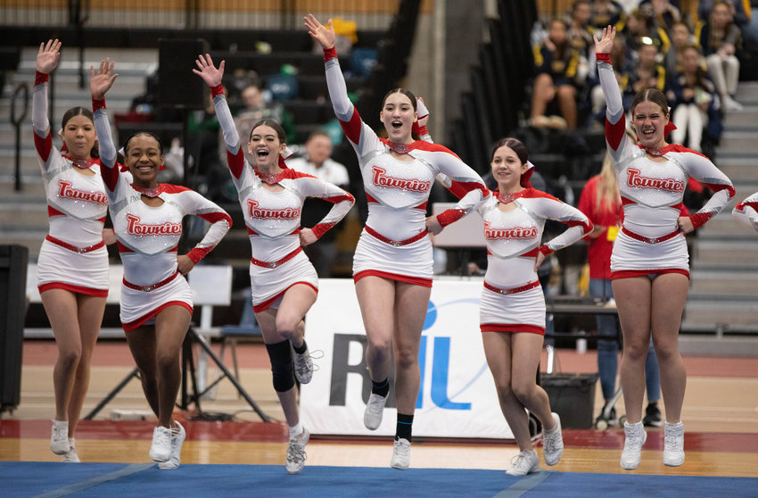 Mackenzie Pacheco (mid-left) and Madison Slavick (mid-right) lead the Townies onto the competition floor.