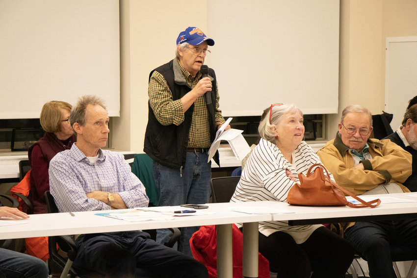 Mike Holtzman, shown speaking during a community energy aggregation meeting in March, said he would like to see accurate, timely information about the program shared with residents.