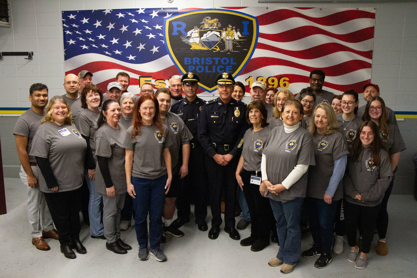 Bristol Police Chief Kevin Lynch and Sgt. Ricardo Mourato pose with the largest graduating class of the department&rsquo;s Citizens Police Academy, which finished up last week.