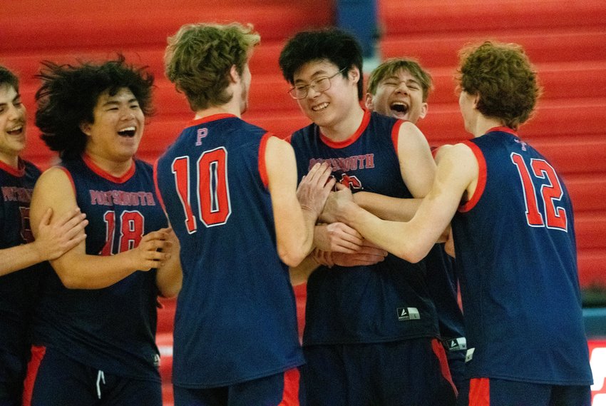 Members of the new Portsmouth High School boys&rsquo; volleyball team &mdash;&nbsp;Evan Vogl, Alex Goss, Hayden Krzych, Leekey Zhang, Sport Foshee and Will Voute (from left) &mdash;&nbsp;celebrate after Zhang hit a successful outside slam during the second set of their home match against Johnsto Monday night.