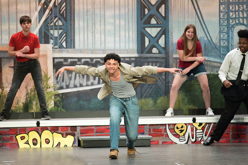 Jeffrey Bento, performing the lead male role of &quot;Usnavi De La Vega,&quot; fronts the East Providence High School Musical Theatre Group's 2023 spring show &quot;In The Heights&quot; during its Thursday, March 30 performance.