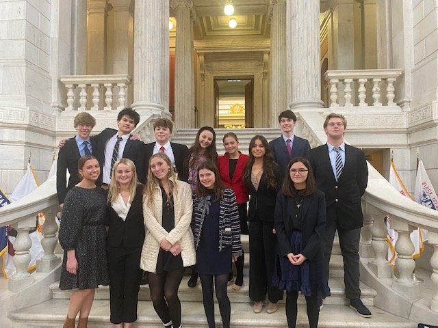 Barrington High School students participated in the recent mock legislative session at the RI Statehouse. Pictured are (from left to right, front row) Lily Da Ponte, Caroline West, Violet Gagliano, Elizabeth Palmeiri, Ajax Holmer, and (back row) Troy Van Ness, Hayden Stubblefield, Luke Van Ness, Calliope Goldman, Addison Jay, Nyomi Herrera, Nolan Franke and Samuel Spector.
