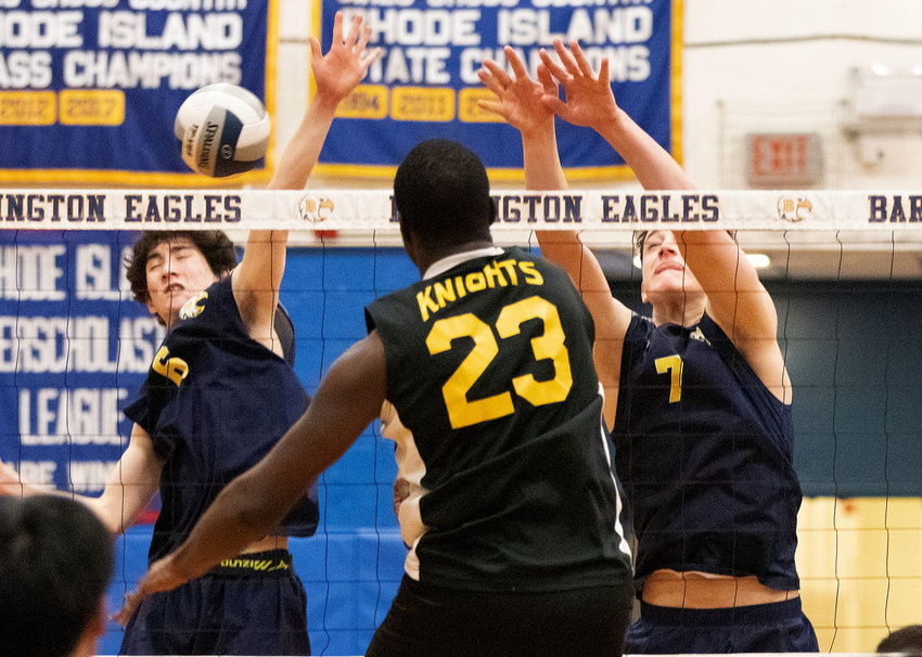 Barrington&rsquo;s SangMin Park (left) and James Ciummo attempt to block a Central spike.