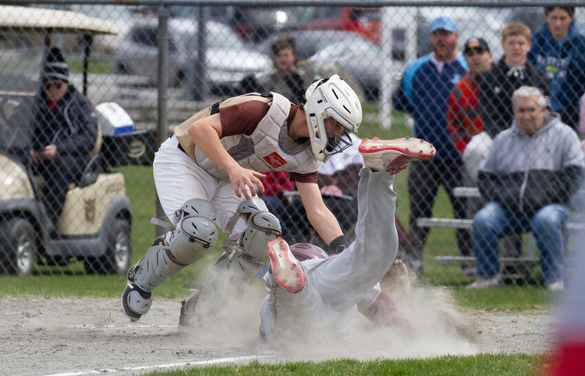 Noah Lacey attempts to tag out a Case baserunner.