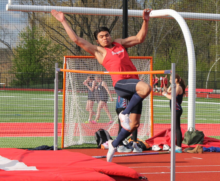 Portsmouth High&rsquo;s Tristan Thomas competes in the high jump during Monday&rsquo;s meet in East Providence. He won the pole vault event with a best effort of 10 feet.