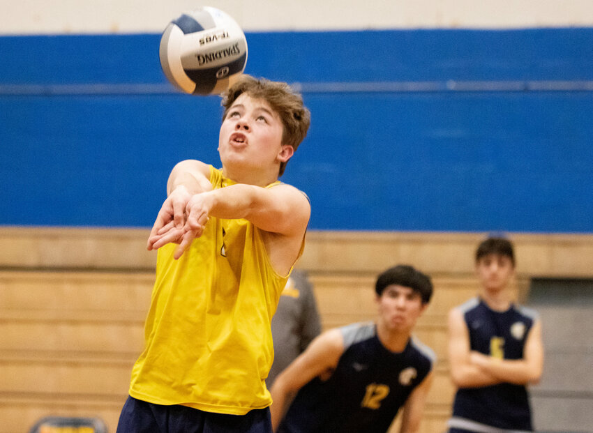 Barrington High School&rsquo;s Luke VanNess sets the ball for a teammate during a recent volleyball match.