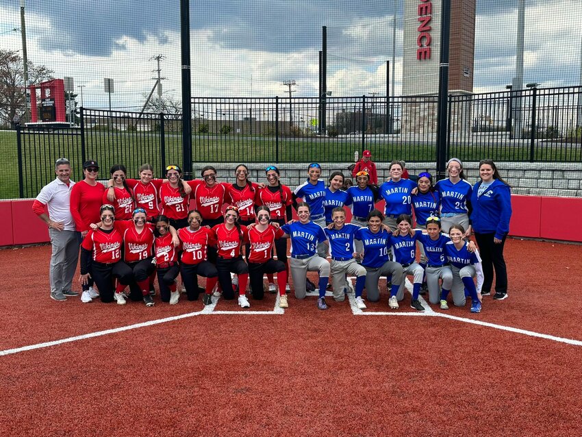The Riverside (red) and Martin Middle School softball teams gather at their Mayor's Cup game played at the new EPHS complex April 25.