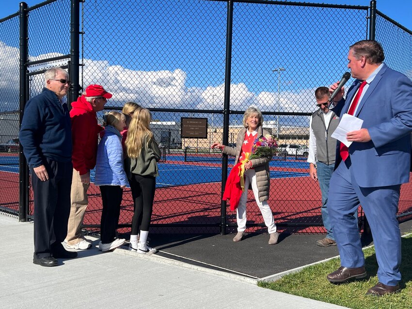 The Gorham family, Facilities Director Chris Murphy and Principal Bill Black gather as the new Scott Gorham memorial plaque at EPHS is unveiled at the Townie Tennis Complex Wednesday, May 3.