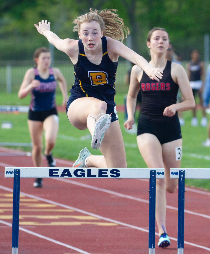 Barrington High School&rsquo;s Jordan Roskiewicz clears a hurdle in the 300-meter hurdle event during the Eastern Division Track Championship on Saturday, May 6. Roskiewicz won the 100- and 300-meter hurdles and her team won the division championship.