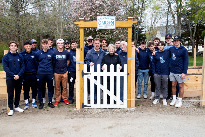 Members of the RWU soccer team turned out in force on Saturday, April 29 of 2023 to help build the Tom&rsquo;s Grove Memorial Garden on the grounds of the Benjamin Church Manor. Pictured here are team members with project coordinators and Manor residents Linda Heroux and Rick Hunter, along with Linda&rsquo;s son Eric Heroux.