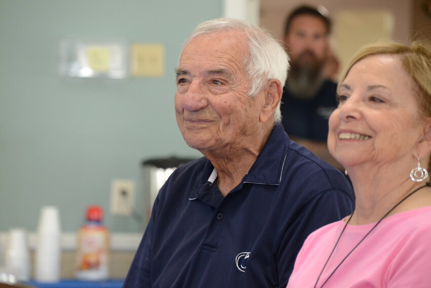 United States Army veteran Arthur Medeiros, who fought in the Battle of the Bulge, smiles beside his daughter, Ellie Joy, during a celebration of his 103rd birthday on May 10 at Benjamin Church Senior Center in Bristol.