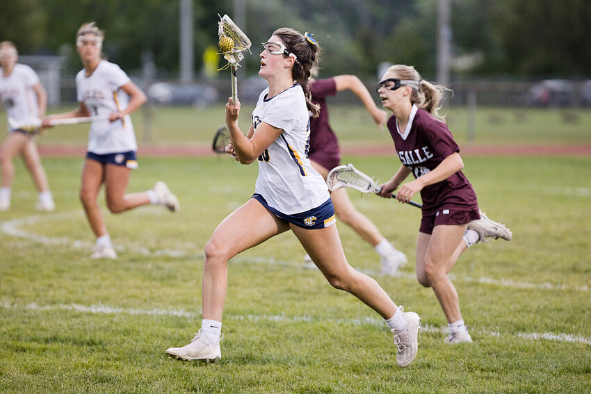 Barrington High School's Anna Lombardi advances the ball toward the goal.