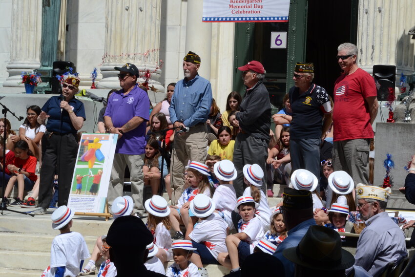 Vietnam War veteran Ginny Hanson, chairman of the Bristol Elks Veterans Committee, gathered with other committee members and veterans to bestow a surprise gift to the children of Colt Andrews Elementary during their annual Memorial Day commemoration event last Friday.