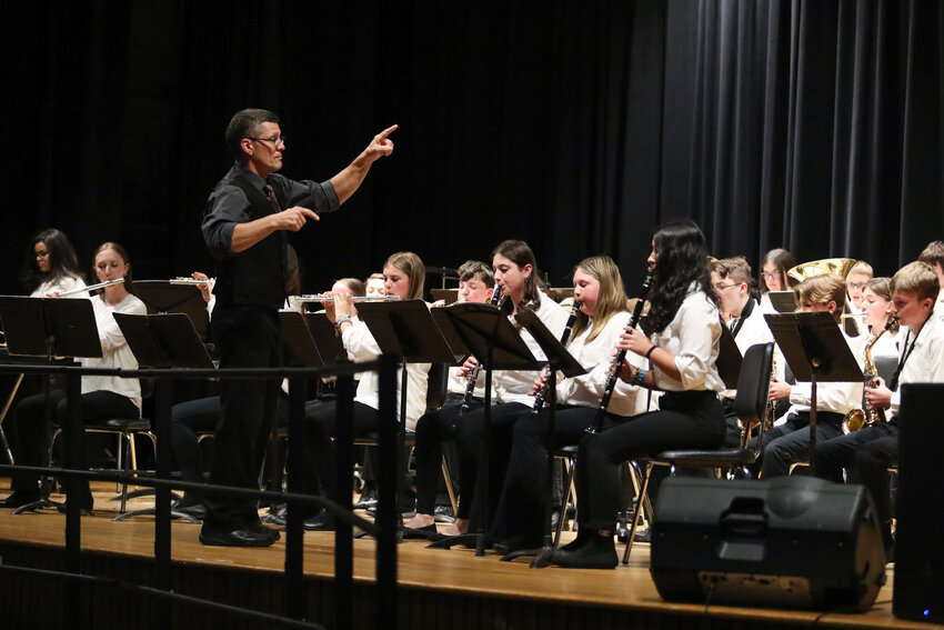 Michael Alves directs the concert band during Tiverton Middle School&rsquo;s spring concert at the high school