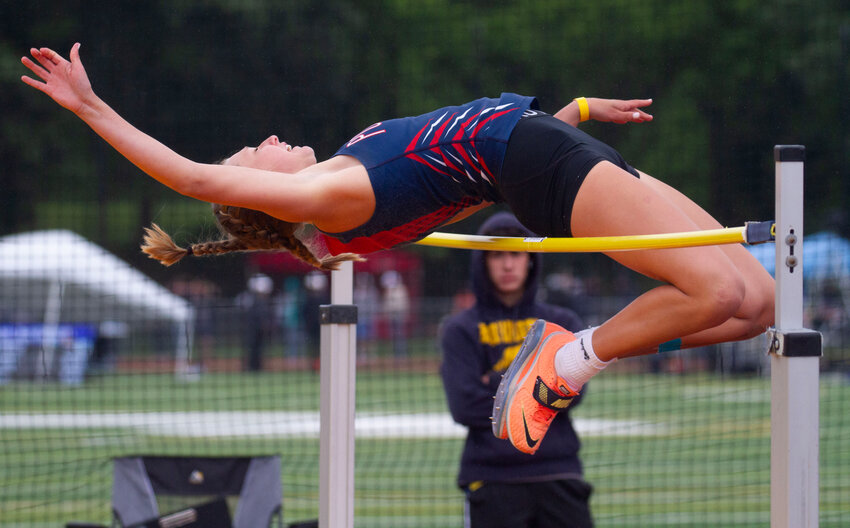 Portsmouth High senior Morgan Casey clears the bar at 5 feet, 2 inches to win the girls&rsquo; high jump event at Saturday&rsquo;s Track and Field State Championships at Conley Stadium in Providence. She was the only first-place winner among the Patriots at the meet.