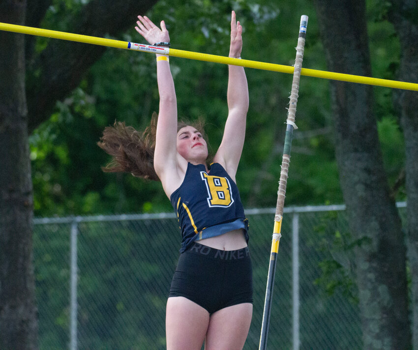 Barrington's Ellie Noonan clears the bar in the pole vault at the state track meet.