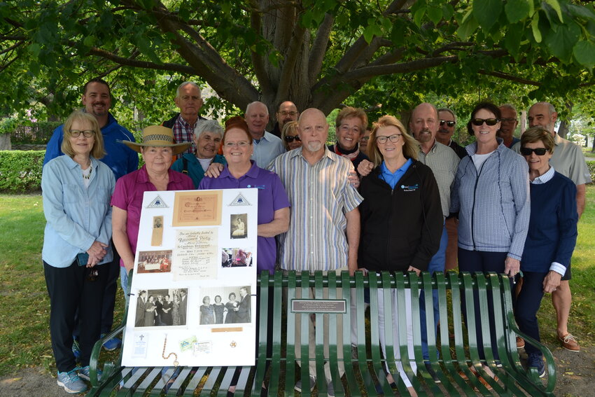 Front row, l-r: Nancy Jacques, Christine Sullivan, Terry Bailey, John Sullivan, Rosemary Fernon, Peter Celone, Tina Celone, Ann Marie Souza-Zaino. Back row, l-r: Tim Shaw, Arthur Quilty, Mary Quilty, Sam Celone, Ann Marie Capelli-Vanner, Ann Texeira, Steve Mascena, Maryann Federico, Richard Federico, Stephen Gancz, and Michael Celone gathered for the re-dedication of a bench in honor of Marie Sullivan.