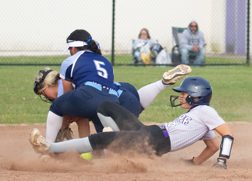 Julia Allen slides safely into second base as Johnston infielders vie for the ball during a bobbled play during Mt. Hope's 8-5 win over Johnston on Thursday.
