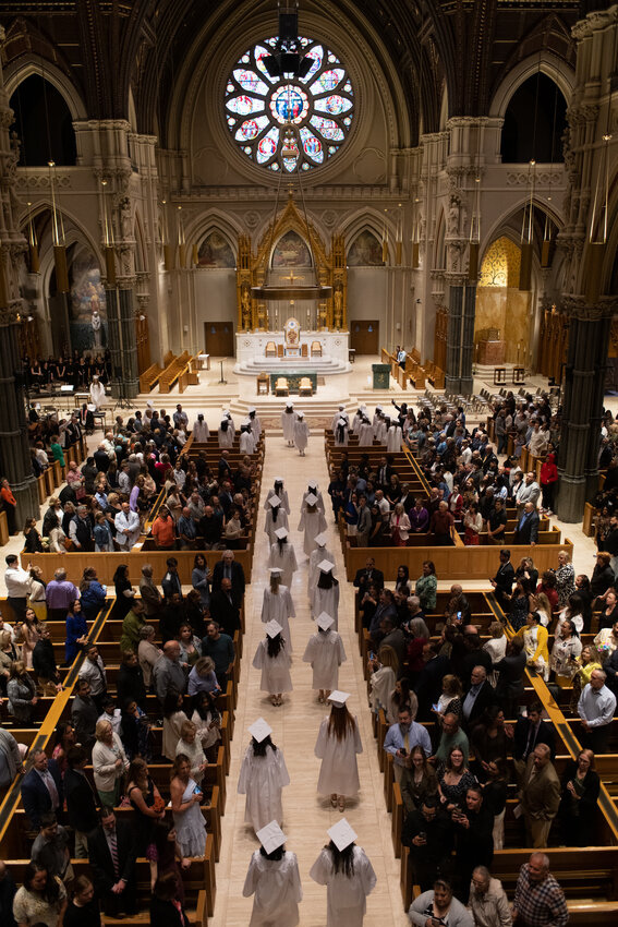 Graduates in the St. Mary Academy-Bay View Class of 2023 enter the Cathedral of Saints Peter and Paul in Providence for commencement on Monday, June 5.
