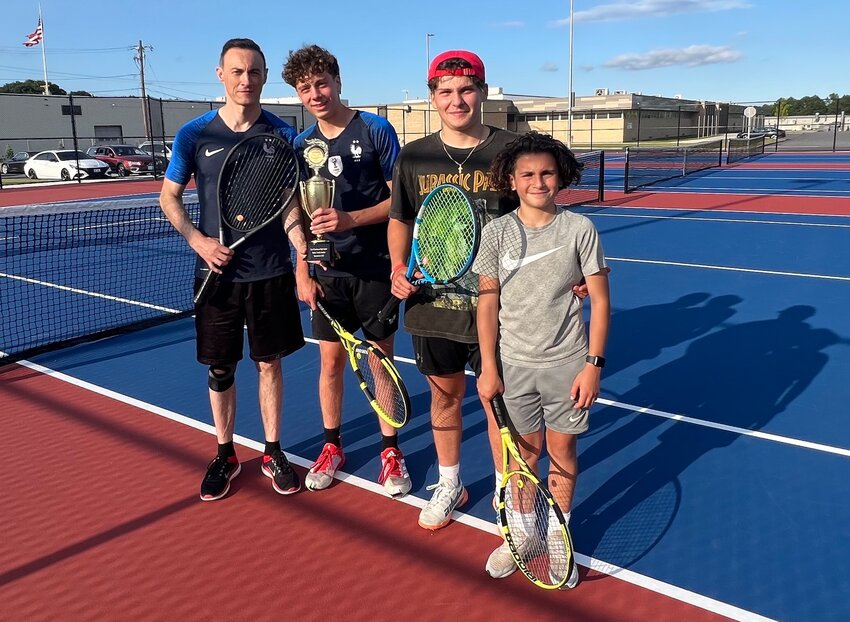 (From left to right) Champions of the inaugural East Providence High School/Friends of Townie Athletics Family Doubles Tennis Tournament Laurent and Justin Petion gather with the runners-up Jaydon and Jared Amaral after the competition finished Saturday, June 10.