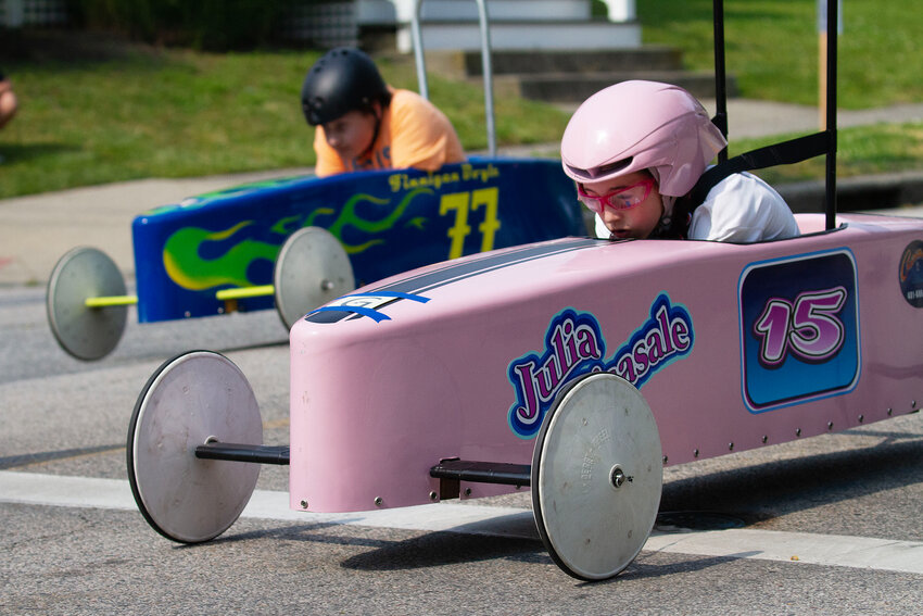 Julia Pisasale, 12, beats Finnegan Boyle,13, to the finish to take her second Orange Crate Derby championship in a row and third overall on Sunday afternoon. The three-time champ in the pink 15 car did not lose a race on Sunday.