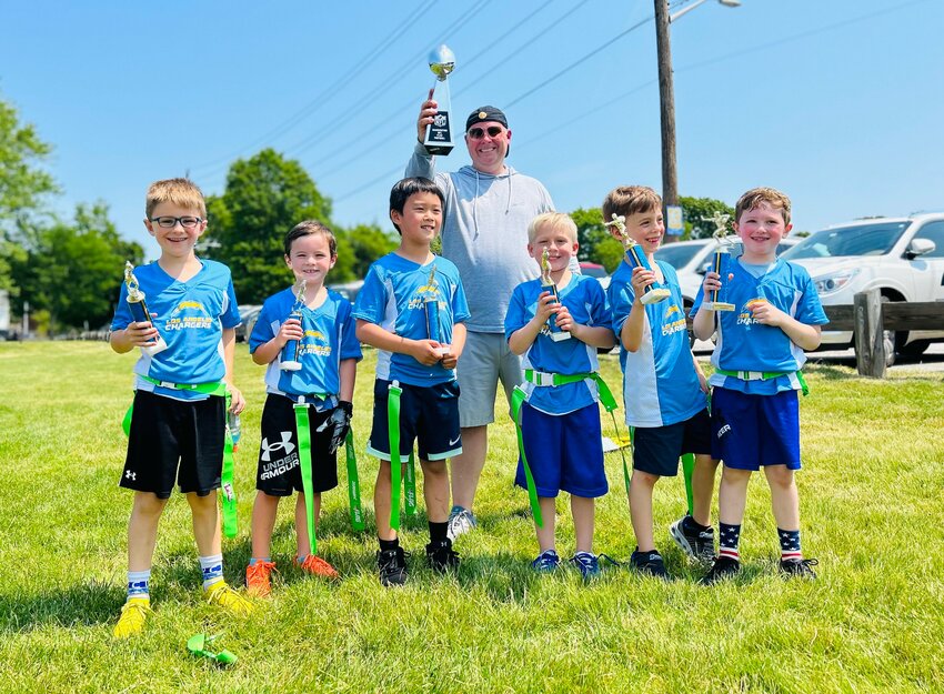 The Chargers celebrate their 6U Division Championship earlier this month.