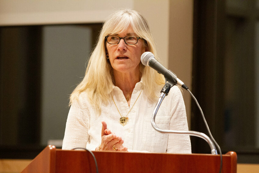 Paige Barbour, shown speaking at an earlier meeting focused on the monastery property, questioned some of the information provided in the town&rsquo;s FAQ document.