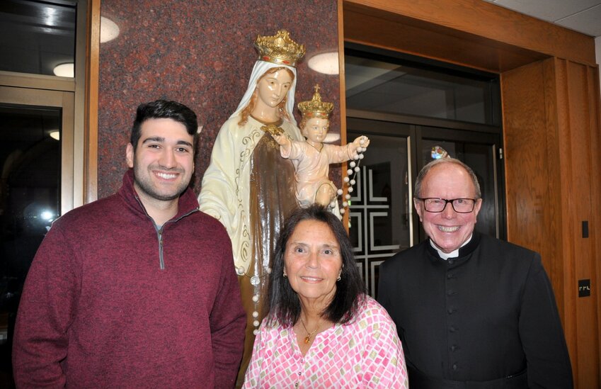 The Our Lady of Mt. Carmel Church Feast Chief Marshal this year is longtime parishioner Denise Asciolla (center). She is flanked by Nicholas Simeone (left, the Thomas Vendituoli Award recipient) and the Rev. Henry P. Zinno Jr., pastor of Mt. Carmel Church.