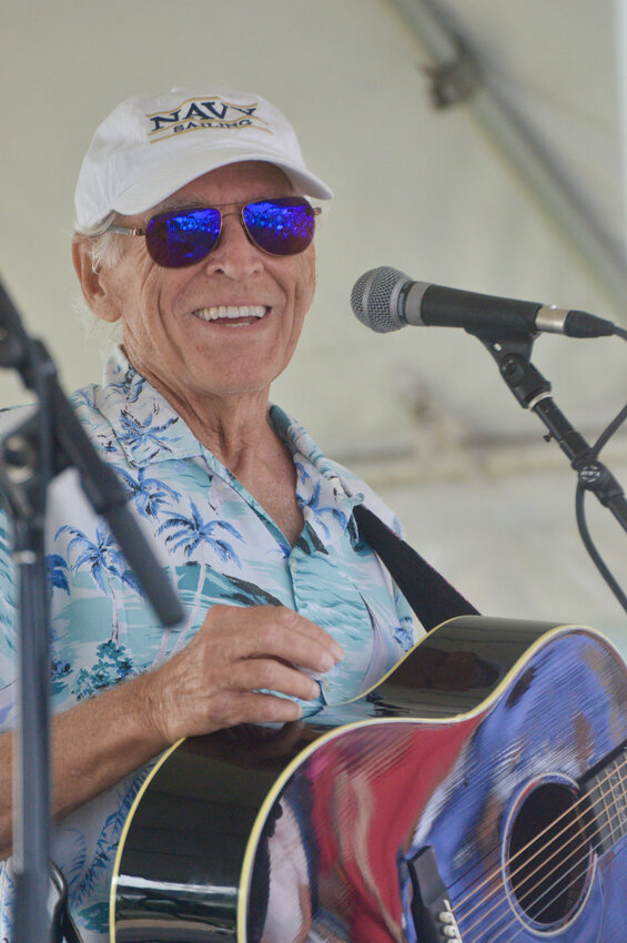 Jimmy Buffett smiles toward the crowd during his surprise appearance at Sunset Cove in Portsmouth on July 2.