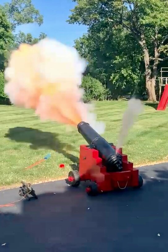 The gunnade, recovered from the bottom of the St. Lawrence River and later fulled restored, fires a blast on a previous Fourth of July.