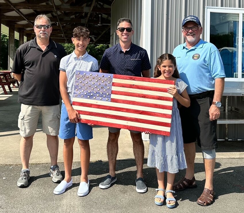 From left: VFP post manager Brian Beaulieu with Mason Auclair, 12, Brian Auclair, Anaya Auclair, 10, and Justin Latini, of the Vietnam Veterans of America council.
