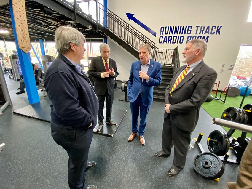 Tiverton Town Administrator Chris Cotta (left) meets with Gov. Dan McKee (second from right) and District 70 Rep. John Edwards of Tiverton (right), this past February.